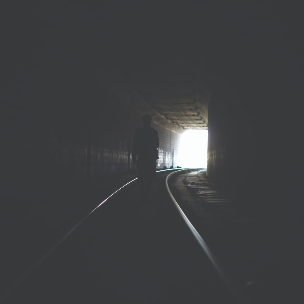A graffiti-covered train in a tunnel